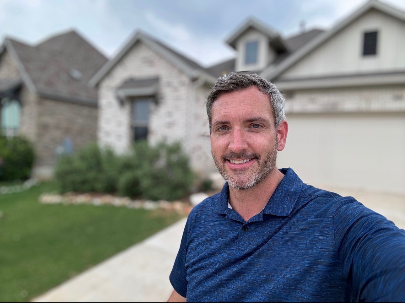 Mark Larson, owner of MTL Construction Services, in front of an Austin home