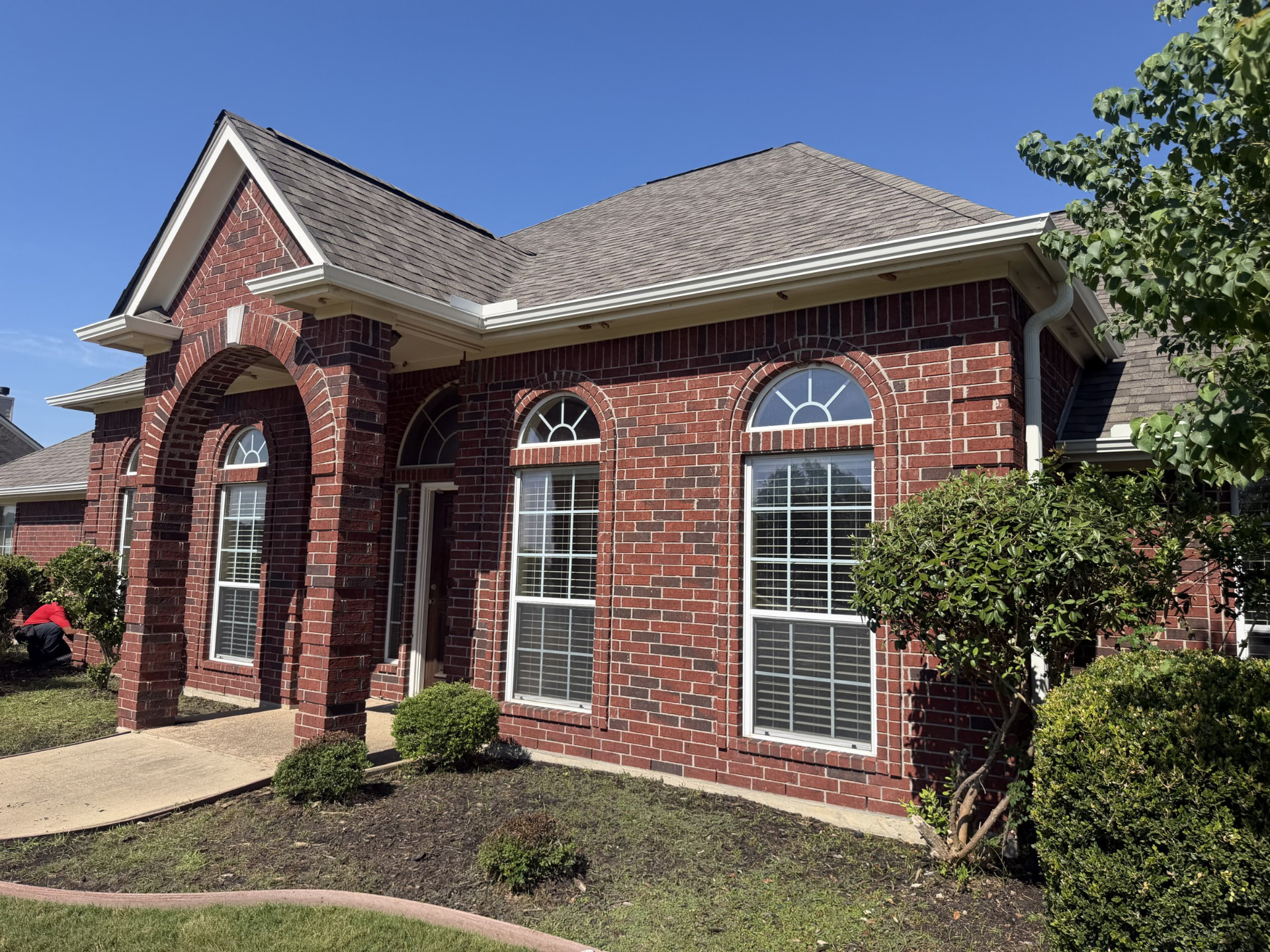 Seamless gutters running along a home's roof edge.
