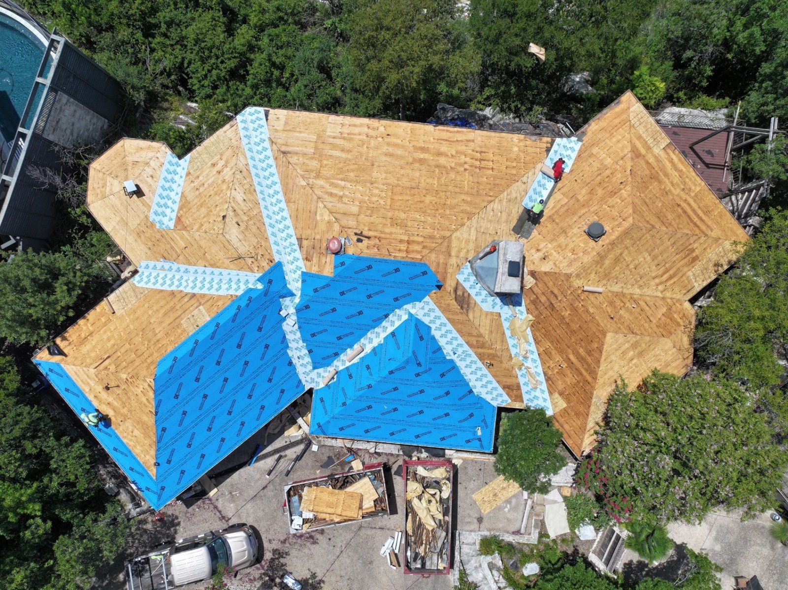 Overhead view of the new underlayment, with extra waterproof membrane in the valleys and along the hips.